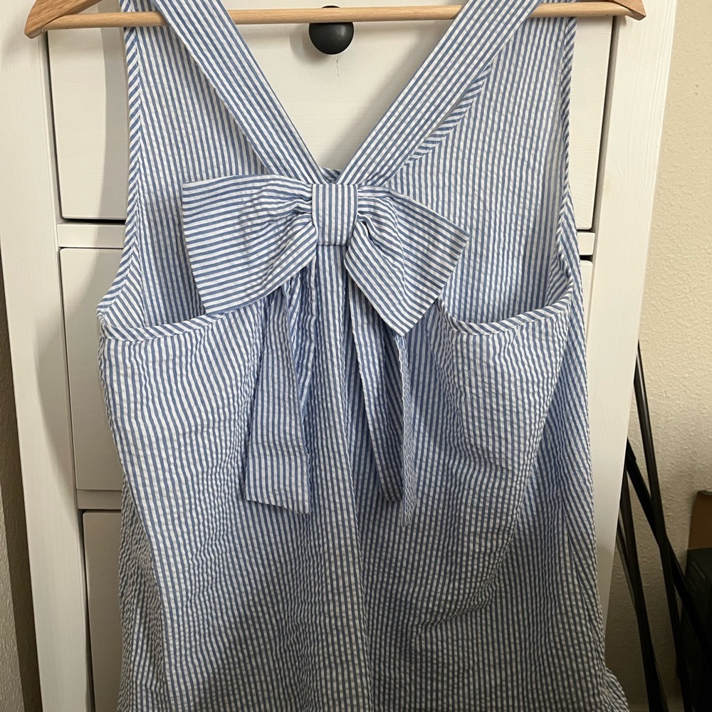 Blue and white striped shirt with bow in the back